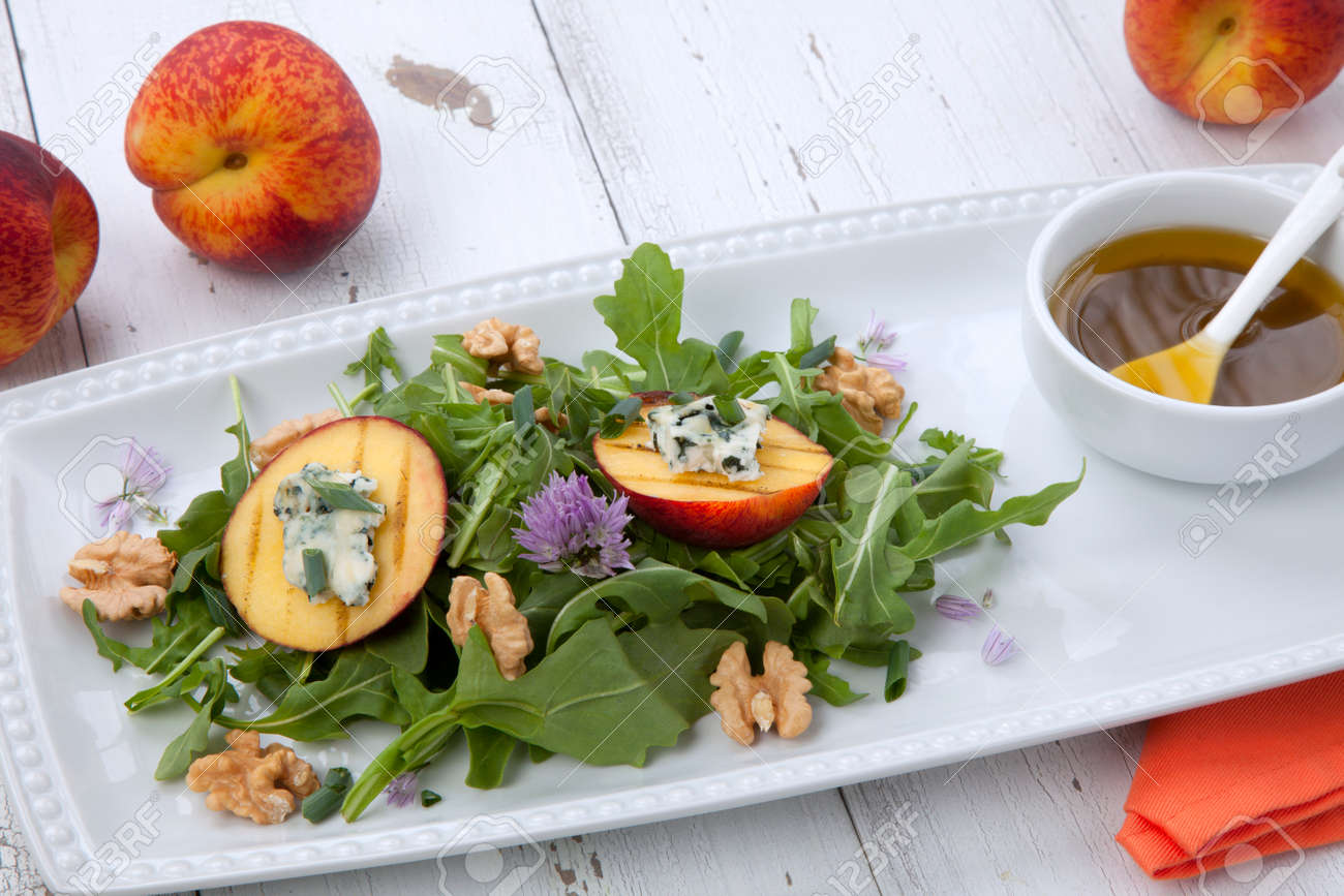 Closeup of blue cheese and peach salad with walnut and arugula. Freash peaches. - 164958974 Closeup of blue cheese and peach salad with walnut and arugula. Freash peaches. - 164958974