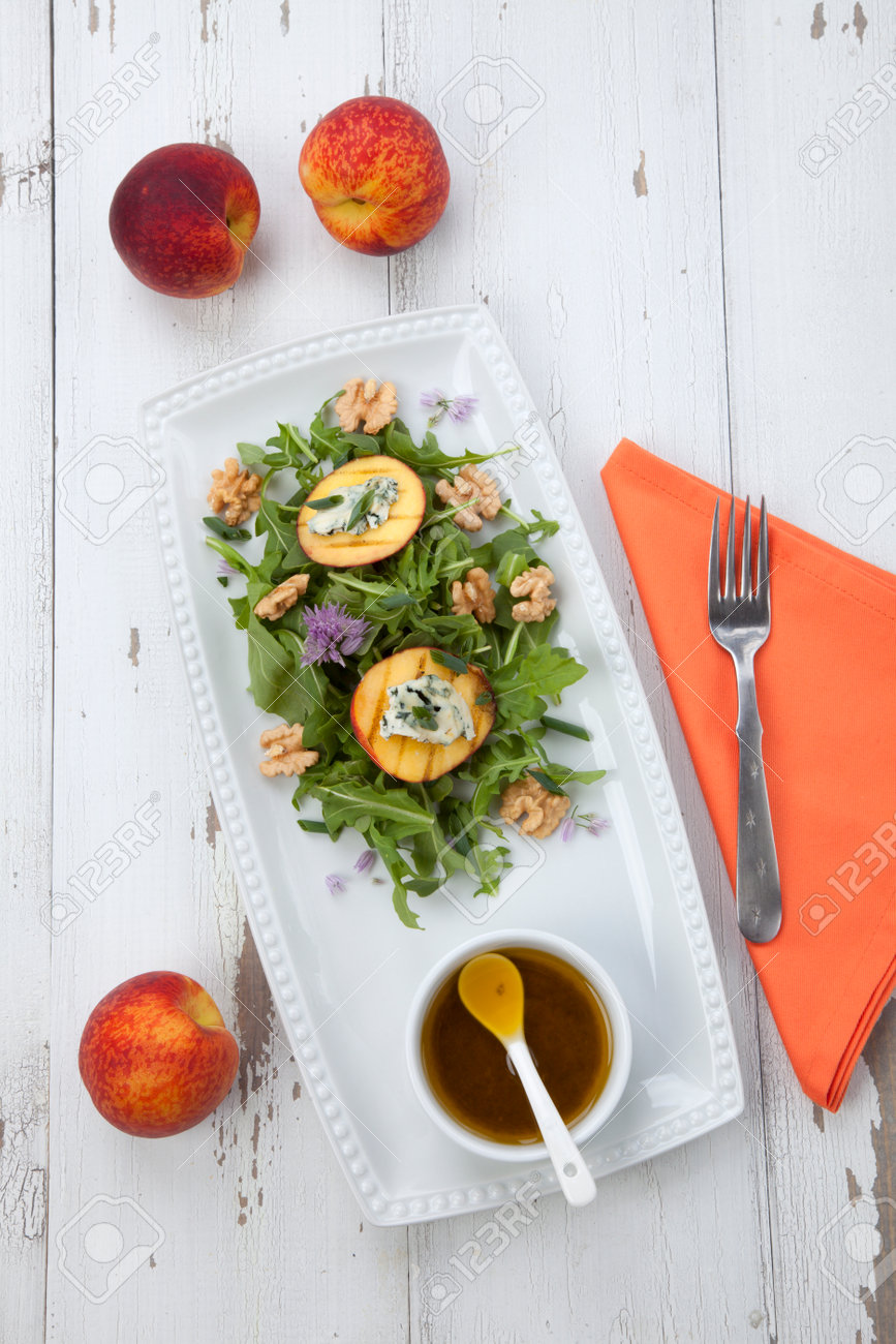 Closeup of blue cheese and peach salad with walnut and arugula. Freash peaches. - 165024010 Closeup of blue cheese and peach salad with walnut and arugula. Freash peaches. - 165024010