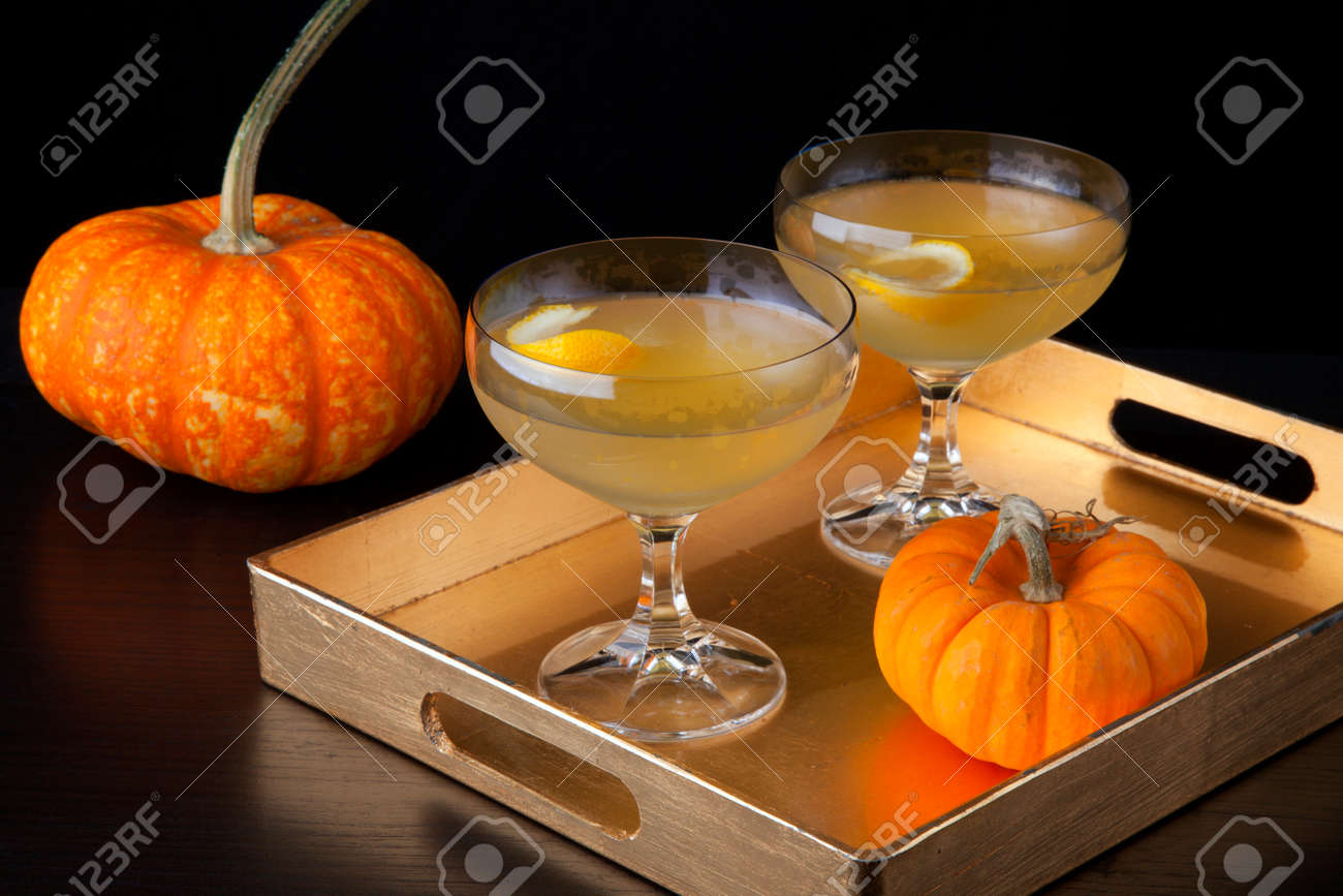 Closeup of Champagne Cocktail on a tray with mini pumpkins. Fall Drinks series. - 171621584 Closeup of Champagne Cocktail on a tray with mini pumpkins. Fall Drinks series. - 171621584