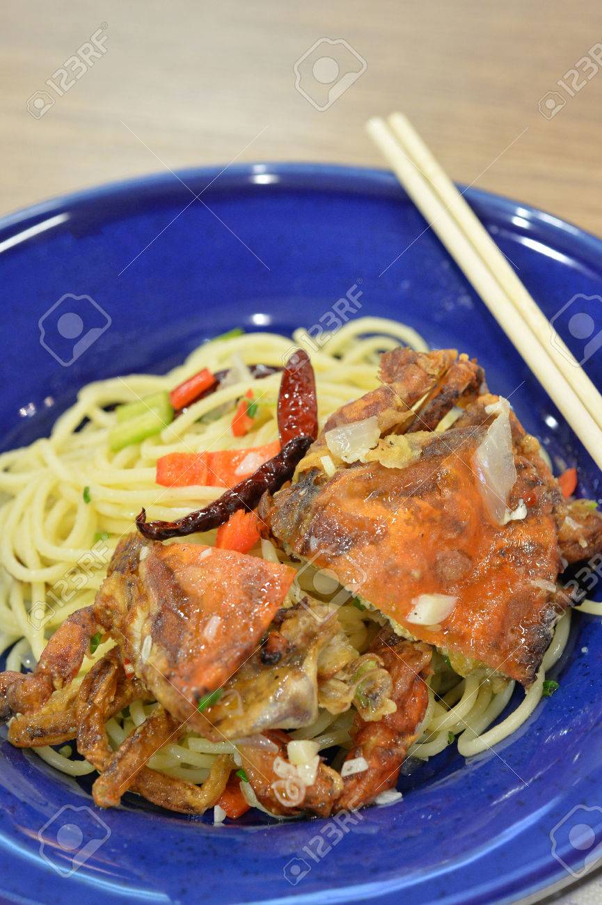 Italian Fusion Food Pan Fried Spaghetti With Olive Oil With Crab And Topping With Deep Fried Soft Shell Crab Selective Focus Stock Photo Picture And Royalty Free Image Image 74089182