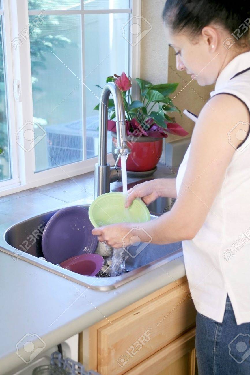 Kitchen Sink With Clean Dishes woman washing dishes in a kitchen sink stock photo, picture and Kitchen Sink With Clean Dishes woman washing dishes in a kitchen sink stock photo, picture and