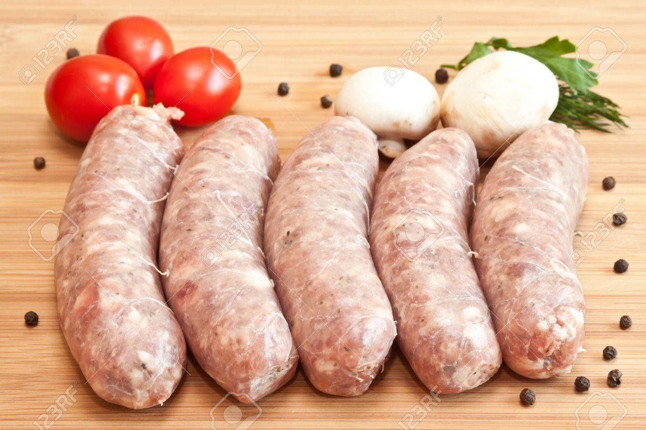 Uncooked Sausage With Vegetables On The 