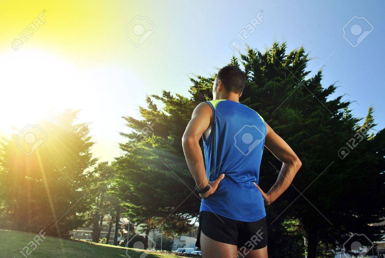 back view of young athlete after doing a long race - 21926359 back view of young athlete after doing a long race - 21926359