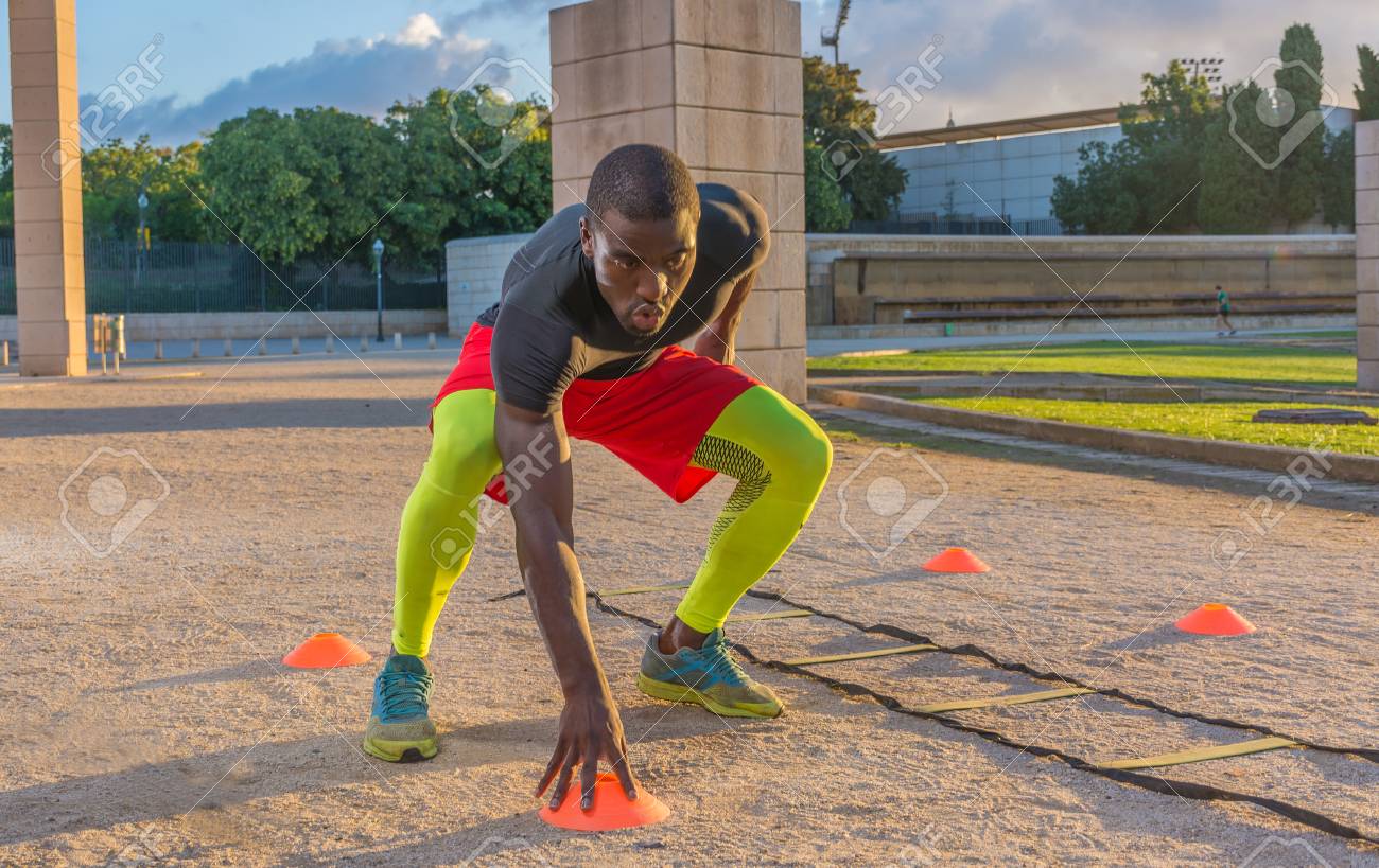 male muscular training ladder to the ground and cones. This serves to increase the speed and reflexes - 86950326 male muscular training ladder to the ground and cones. This serves to increase the speed and reflexes - 86950326