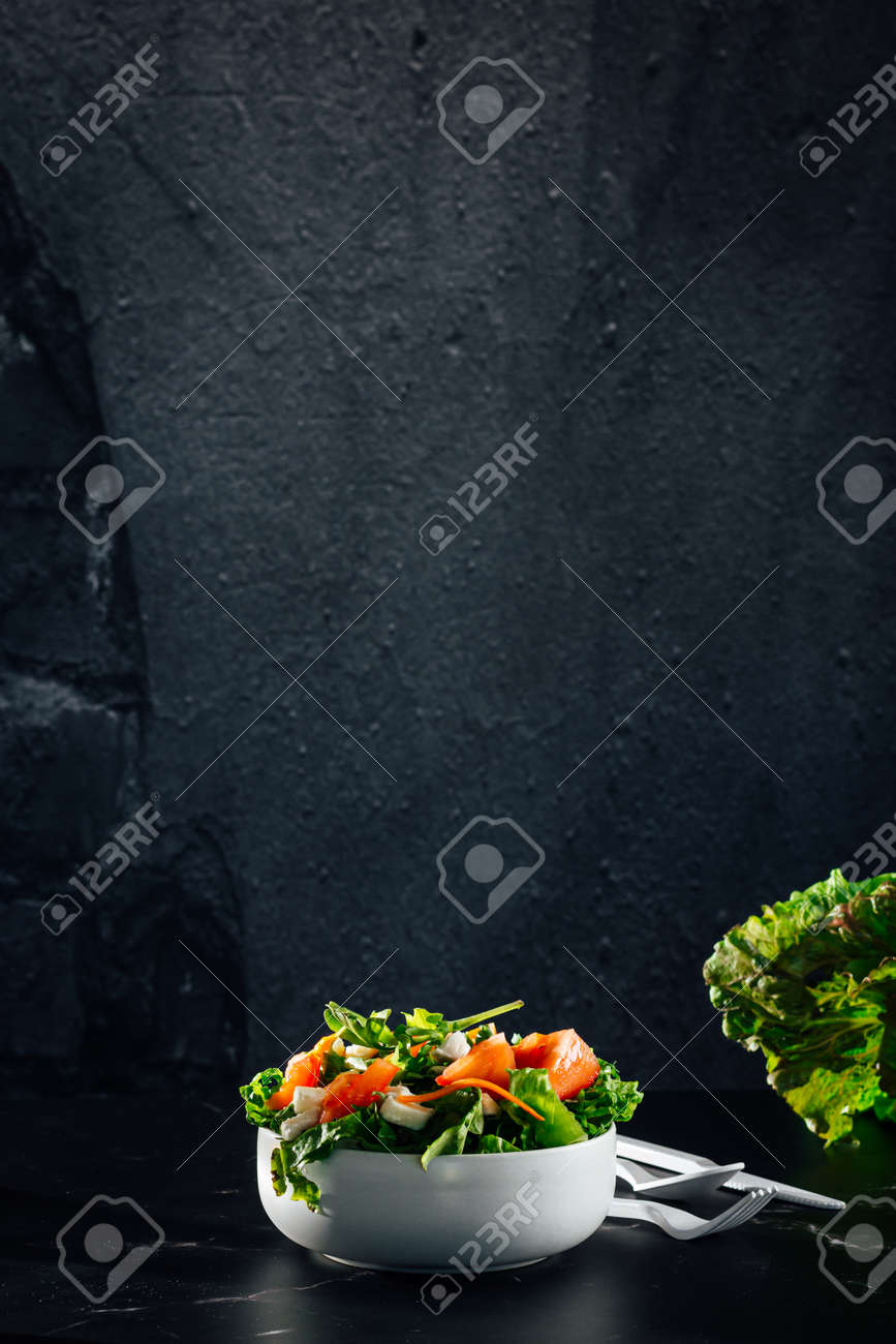 Mixed salad bowl with lettuce, tomato, arugula and mozzarella cheese. (Concept of healthy and organic food) - 165273821 Mixed salad bowl with lettuce, tomato, arugula and mozzarella cheese. (Concept of healthy and organic food) - 165273821