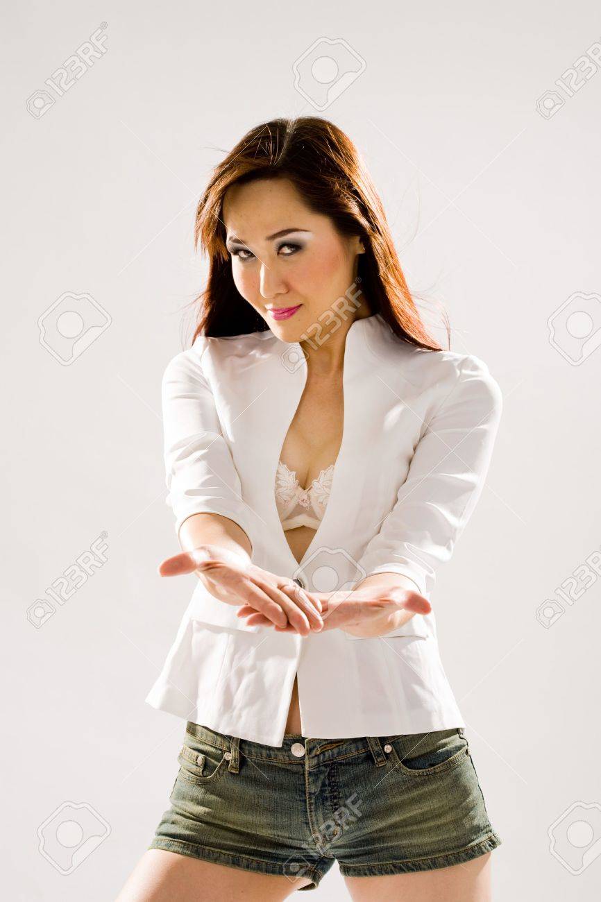 a very sexy bold woman in tight denim shorts and high boots stock very bold image
