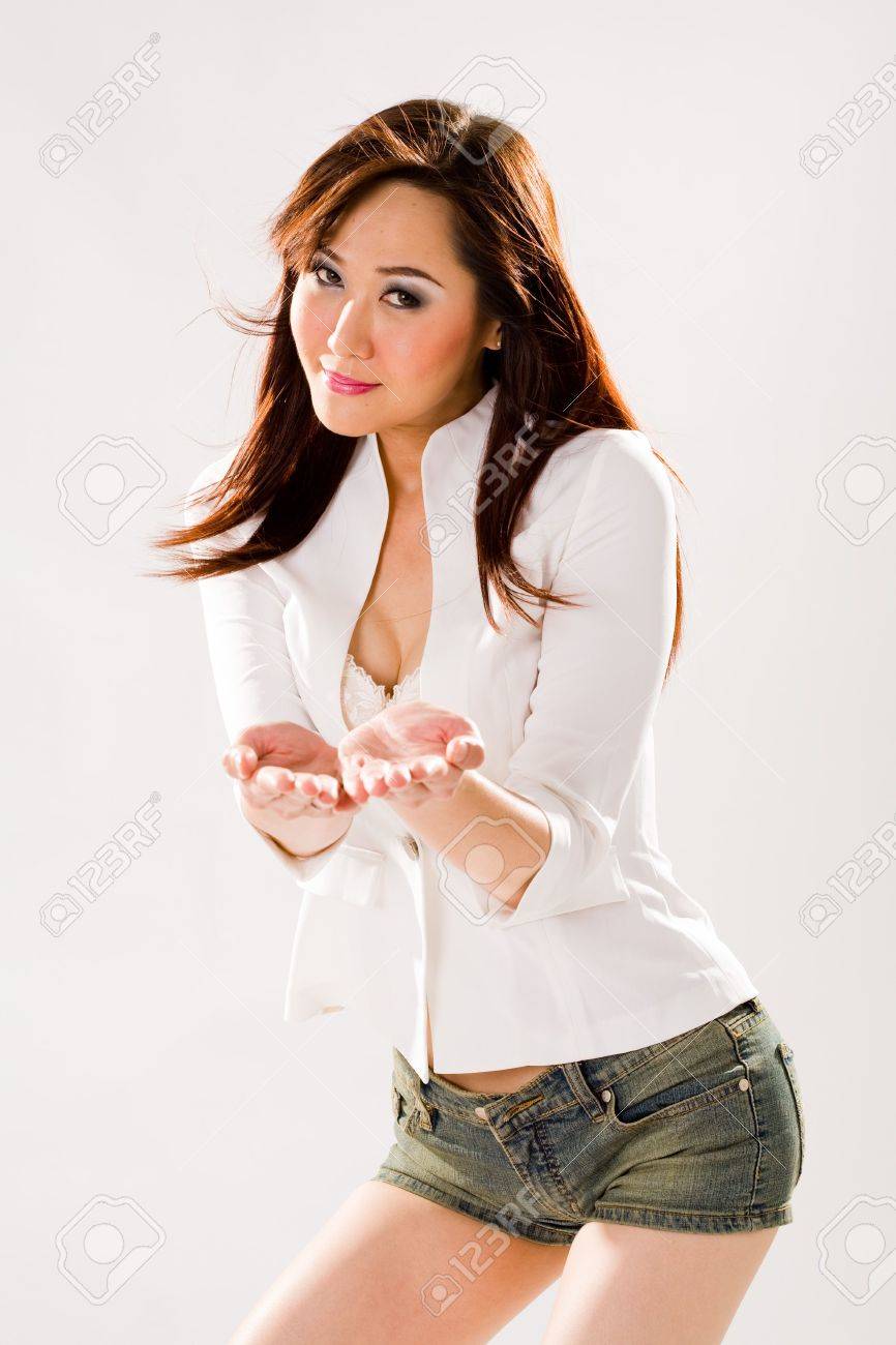 a very sexy bold woman in tight denim shorts and high boots stock very bold image