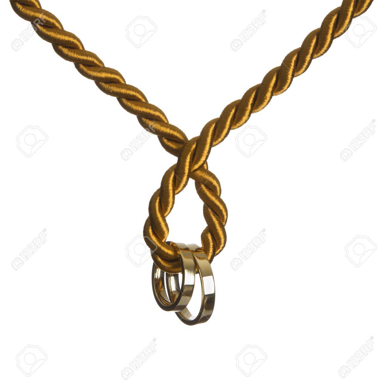Silver Wedding Rings Hanging From A Golden Cordon Stock Photo, Picture and  Royalty Free Image. Image 29448620., image size:1300x1300