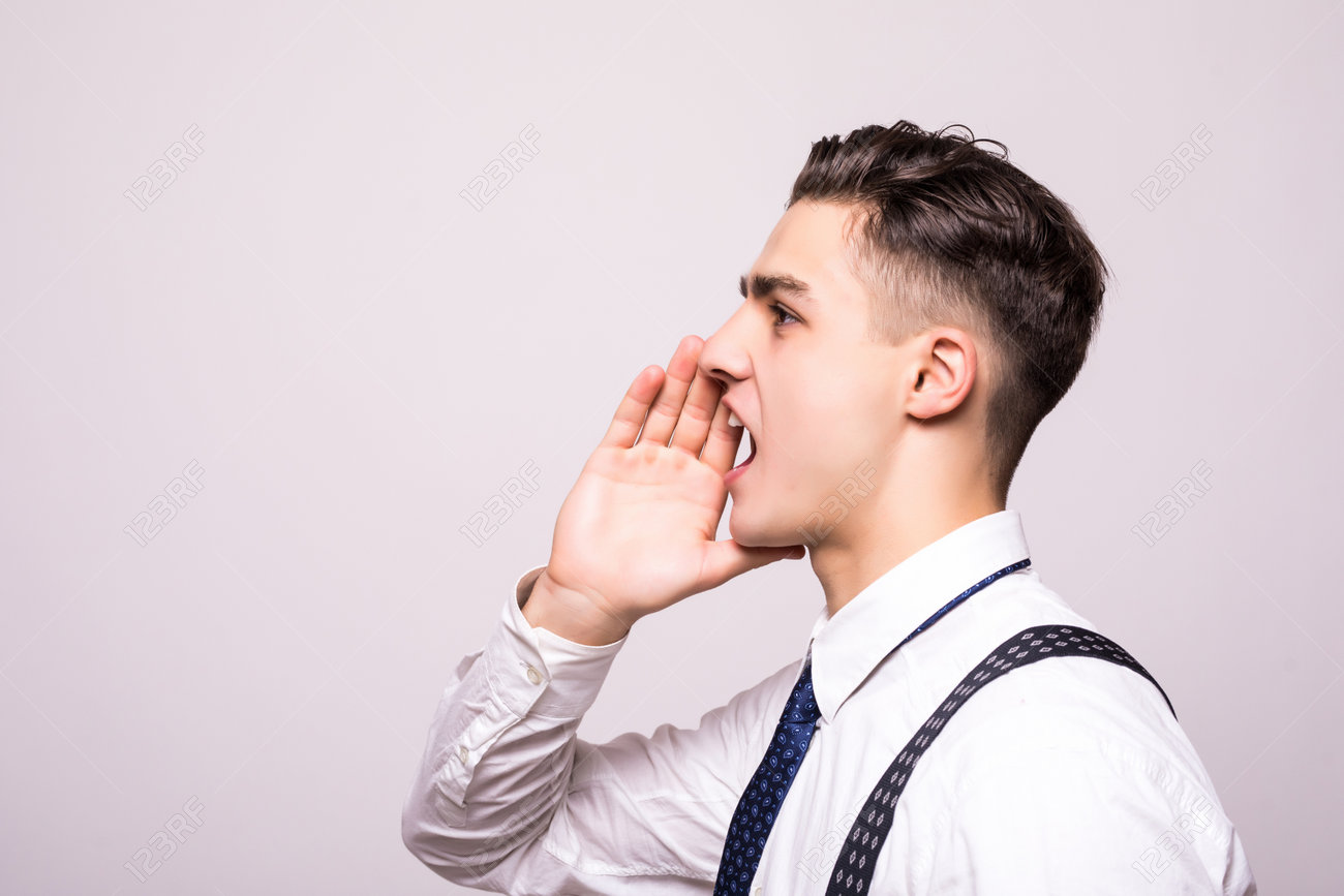 Closeup Side View Profile Portrait, Angry Upset Young Man, Worker,  Employee, Business Man, Hand To Mouth, Open Mouth Yelling, Isolated White  Background. Stock Photo, Picture And Royalty Free Image. Image 94655820.