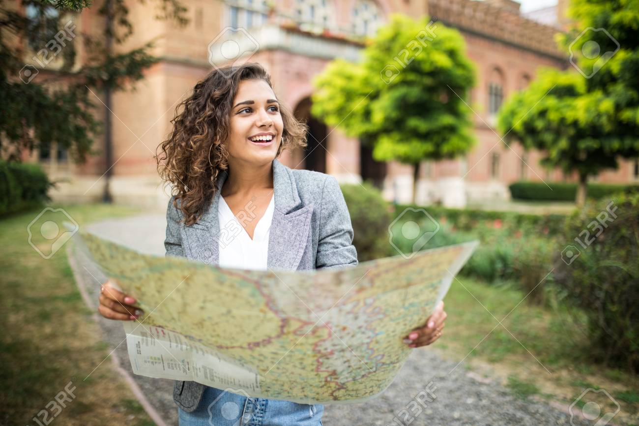 Street Guide In Tourism Travel Guide, Tourism In Europe, Woman Tourist With Map On The Street Stock  Photo, Picture And Royalty Free Image. Image 112265095.