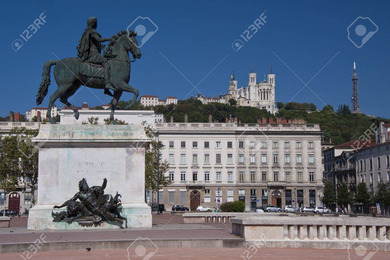 view of the equestrian statue of louis xiv and the basilica of notre dame de fourviere from place bellecour, in the center of lyon - 15437536 view of the equestrian statue of louis xiv and the basilica of notre dame de fourviere from place bellecour, in the center of lyon - 15437536