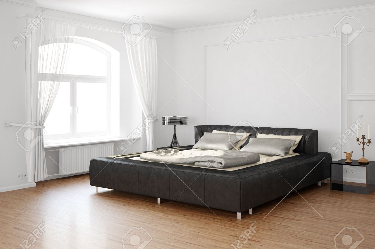 Sleeping Room With Bed And Hardwood Floor Stock Photo Picture And
