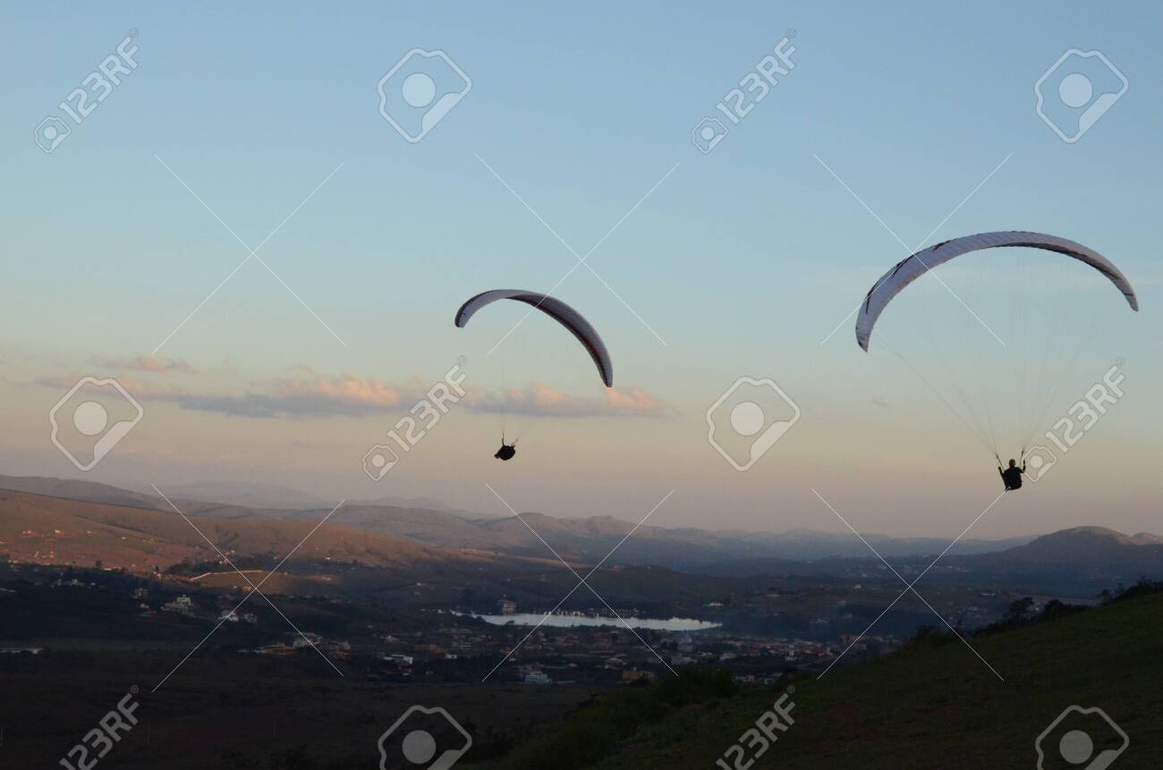 Two Paraglidings at sun set in Topo do Mundo (translated to Top of the World) in Minas Gerais - 151603444 Two Paraglidings at sun set in Topo do Mundo (translated to Top of the World) in Minas Gerais - 151603444