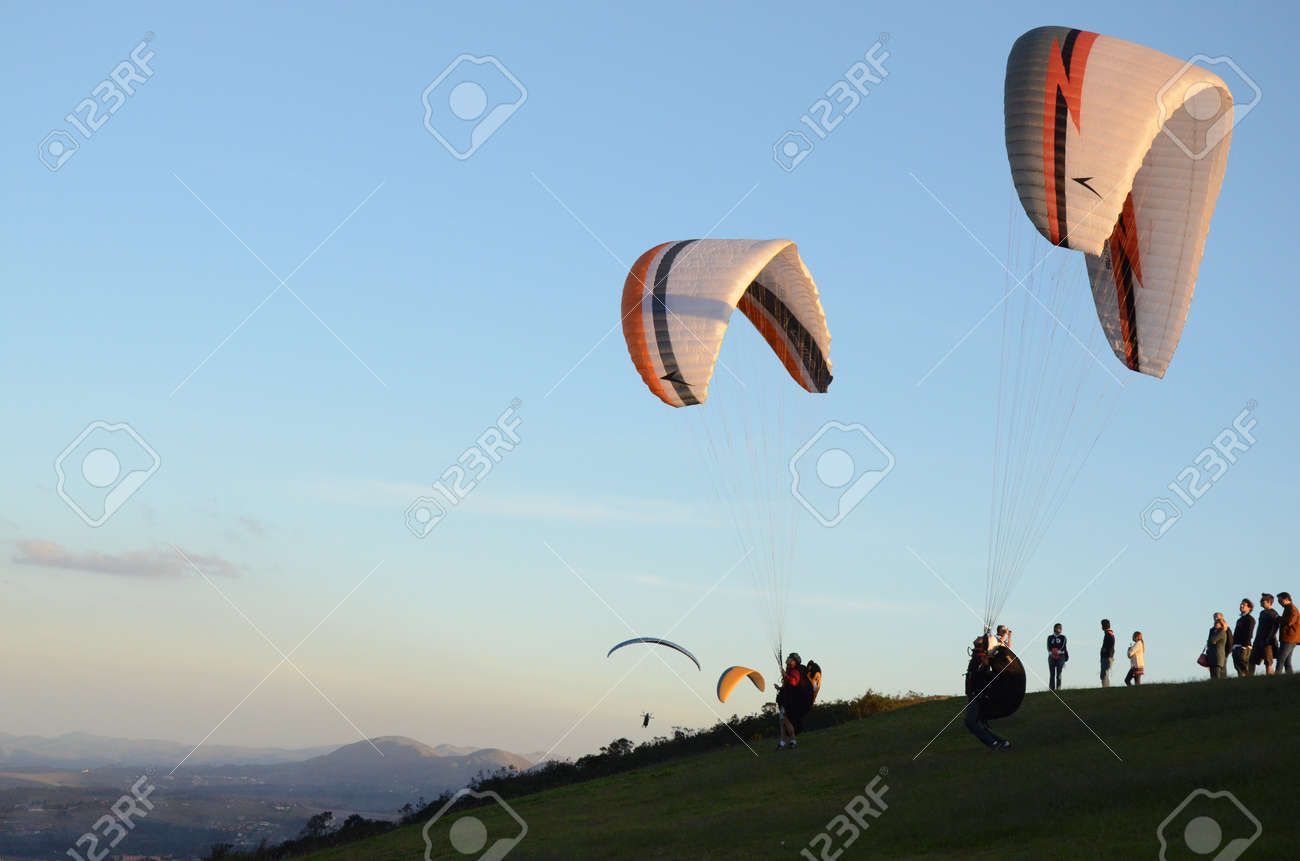 Two Paraglidings rising at sun set in Topo do Mundo (translated to Top of the World) in Minas Gerais - 151596709 Two Paraglidings rising at sun set in Topo do Mundo (translated to Top of the World) in Minas Gerais - 151596709