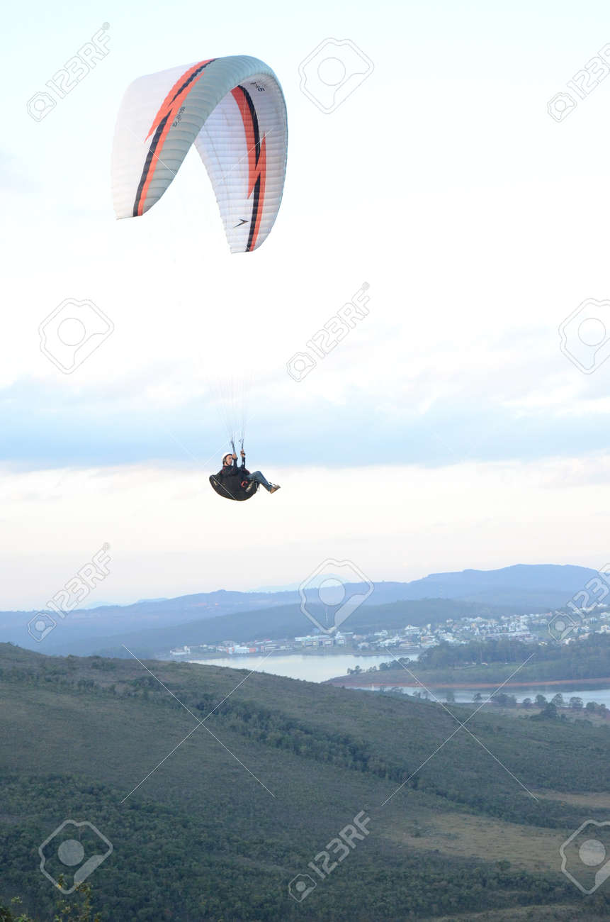 Paragliding at sun set in Topo do Mundo (translated to Top of the World) in Minas Gerais - 151596712 Paragliding at sun set in Topo do Mundo (translated to Top of the World) in Minas Gerais - 151596712