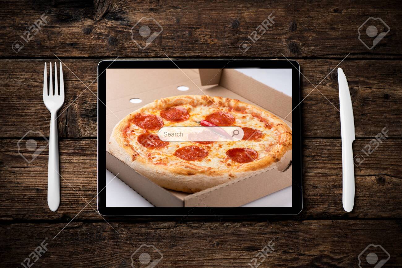 a tablet to order food delivery at home with pizza home delivery stock photo picture and royalty free image image 143854344