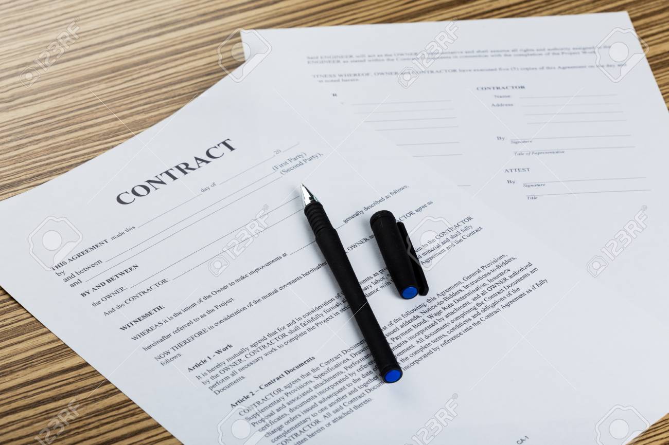 https://previews.123rf.com/images/fabrikacrimea/fabrikacrimea1709/fabrikacrimea170903743/85925146-pen-and-contract-papers-on-wooden-desk.jpg