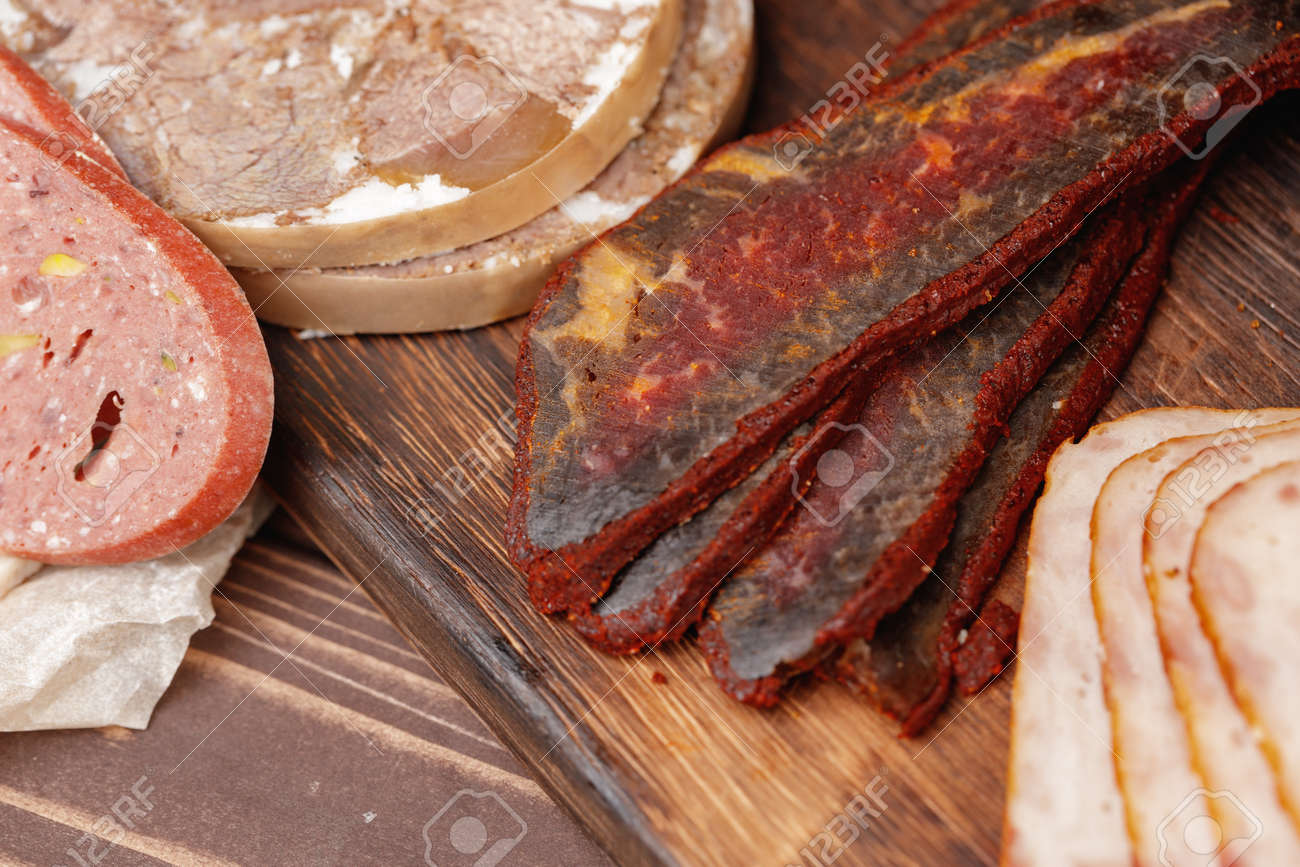 Variety of meat and sausage products on table - 168762302 Variety of meat and sausage products on table - 168762302