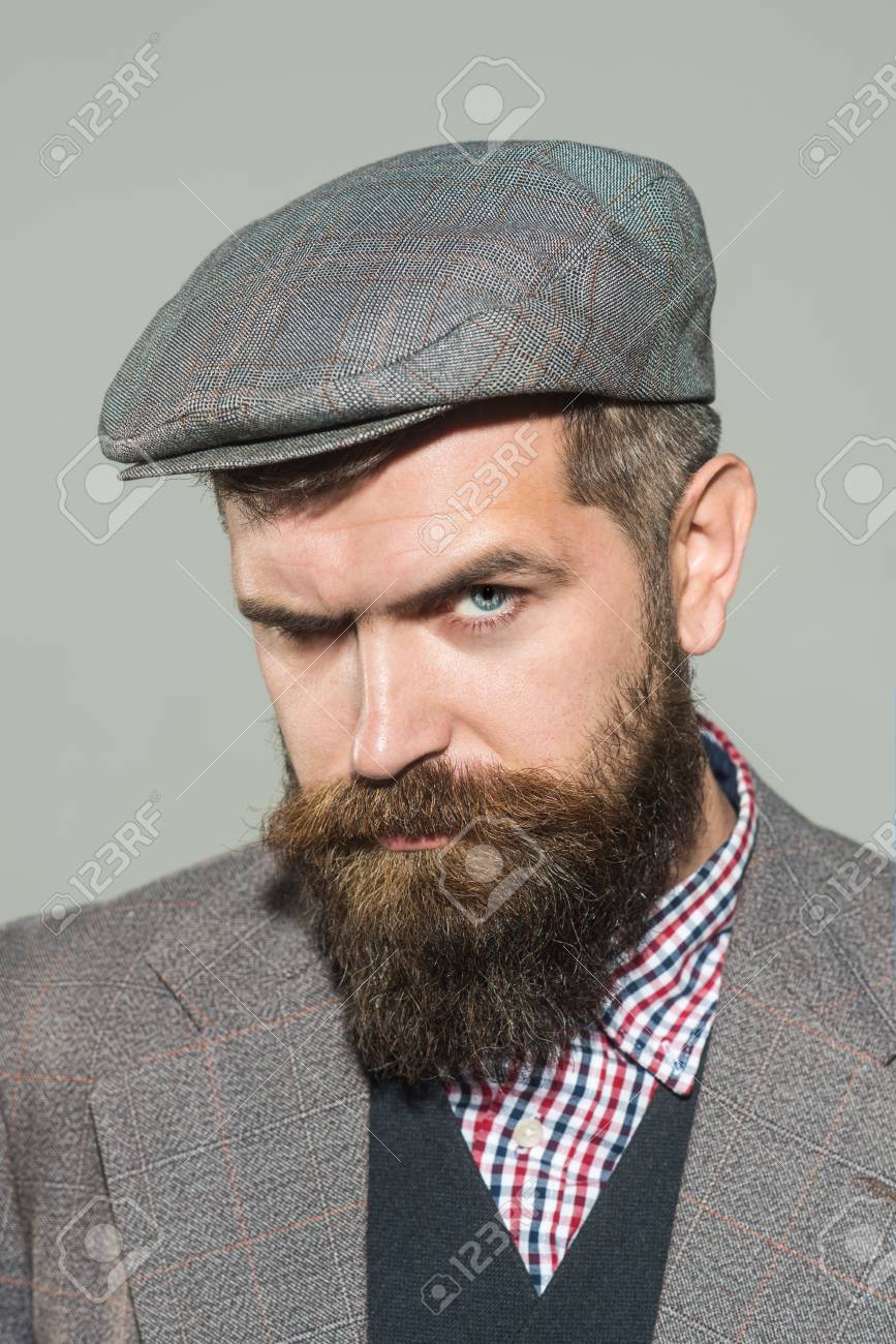 beard and flat cap