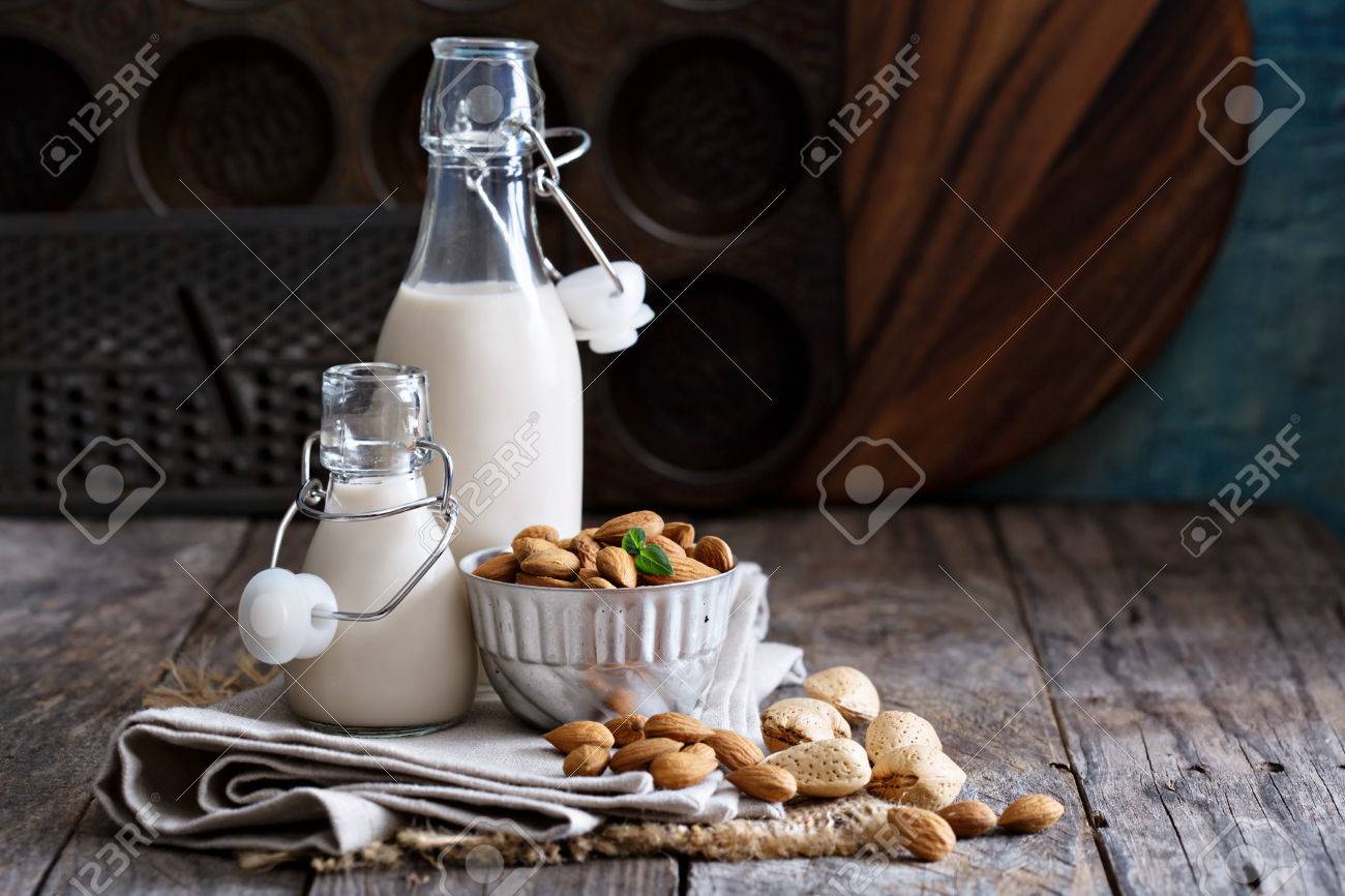 Almond nut vegan milk non dairy in different bottles with copy space - 50965515 Almond nut vegan milk non dairy in different bottles with copy space - 50965515