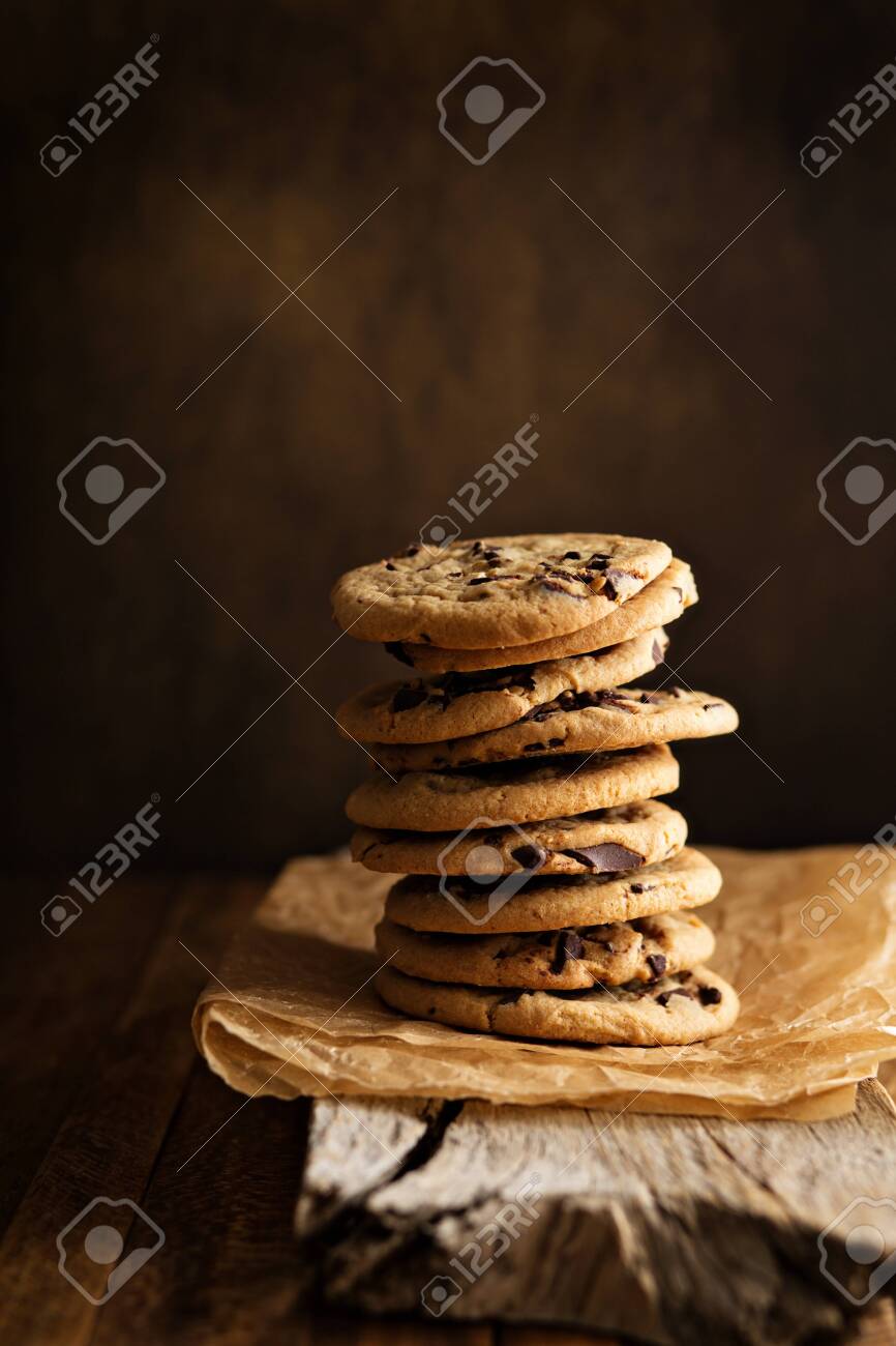 Homemade chocolate chip cookies stacked in a rusting setting - 122038444 Homemade chocolate chip cookies stacked in a rusting setting - 122038444