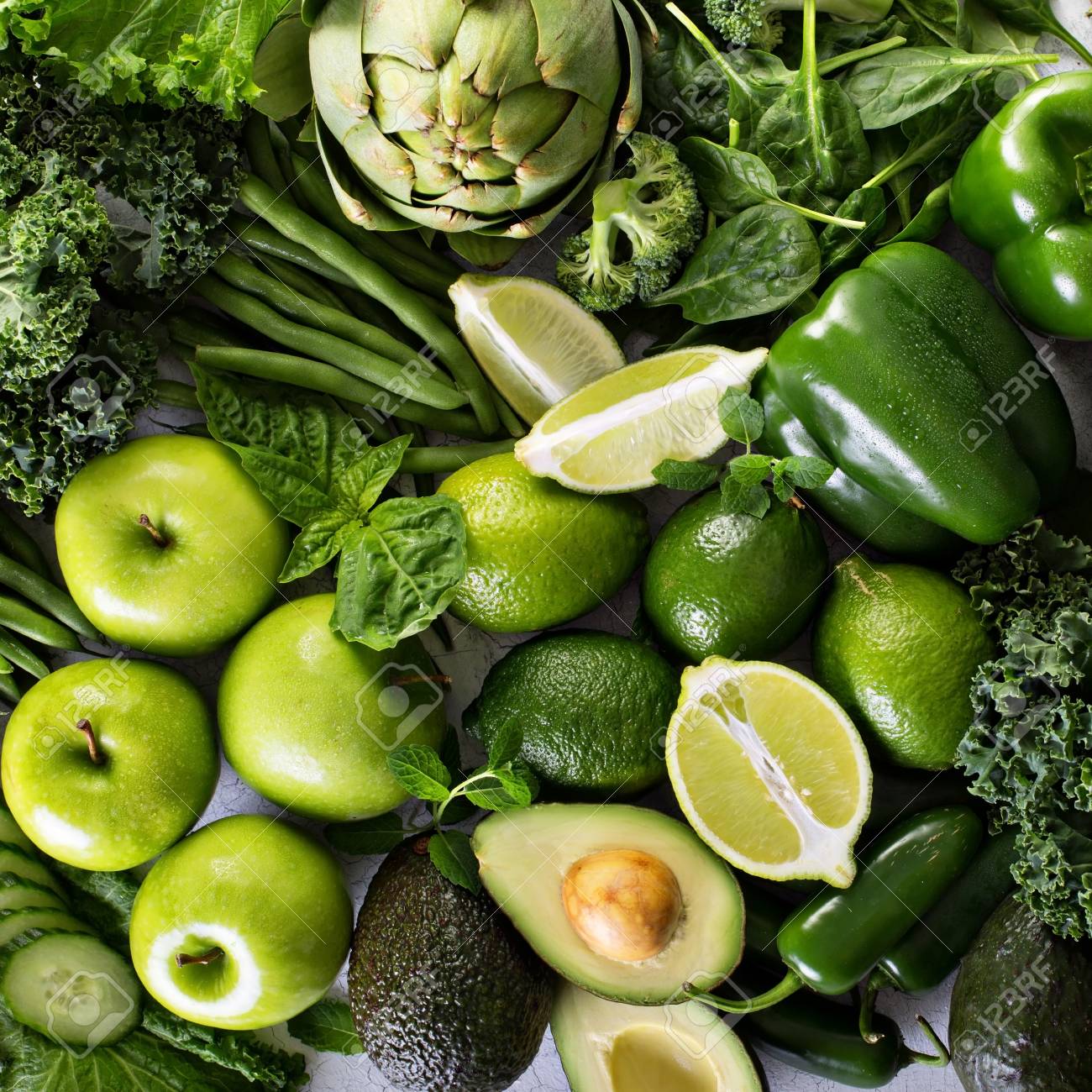 Variety Of Green Vegetables And Fruits Spread On The Table Stock Photo,  Picture and Royalty Free Image. Image 71071360., image size:1300x1300