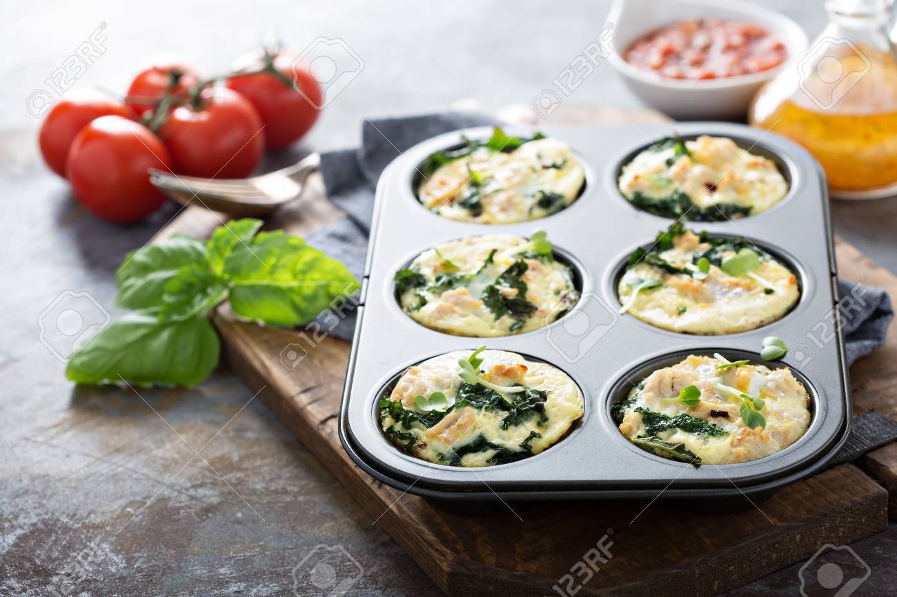 High protein egg muffins with kale and ground turkey in a muffin tin - 94418088 High protein egg muffins with kale and ground turkey in a muffin tin - 94418088