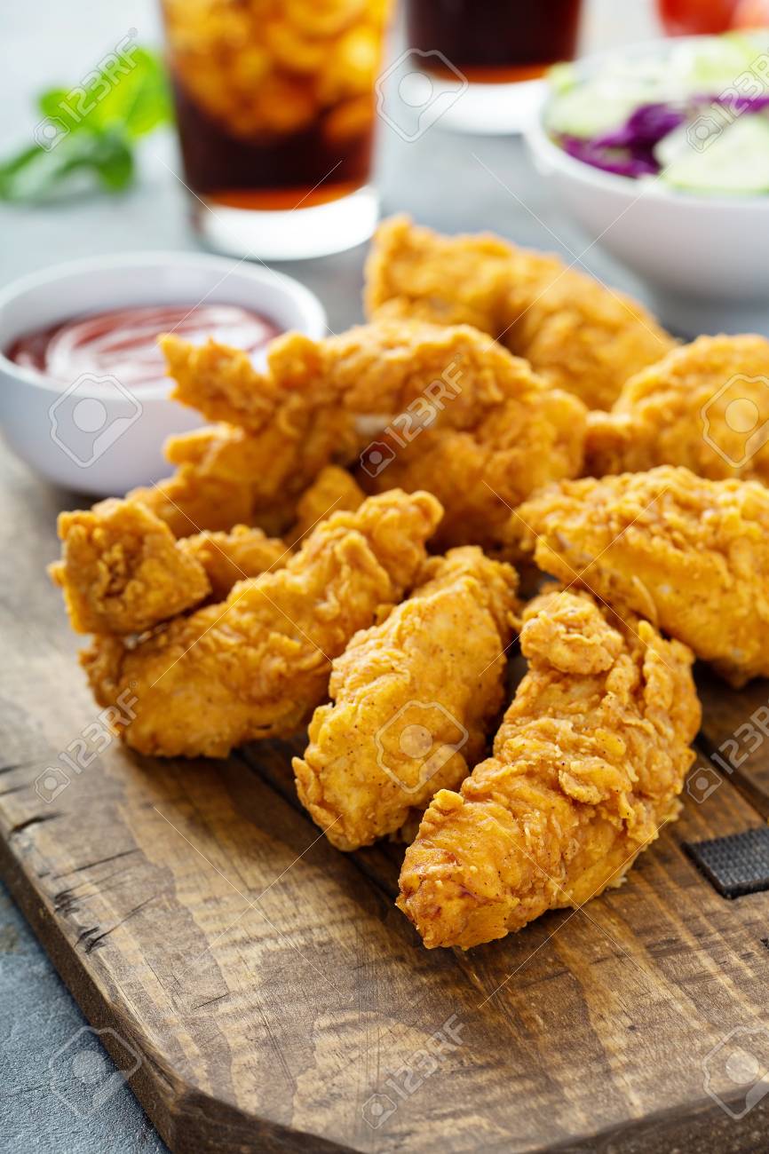 Breaded chicken tenders with ketchup, salad and soda - 94477592 Breaded chicken tenders with ketchup, salad and soda - 94477592