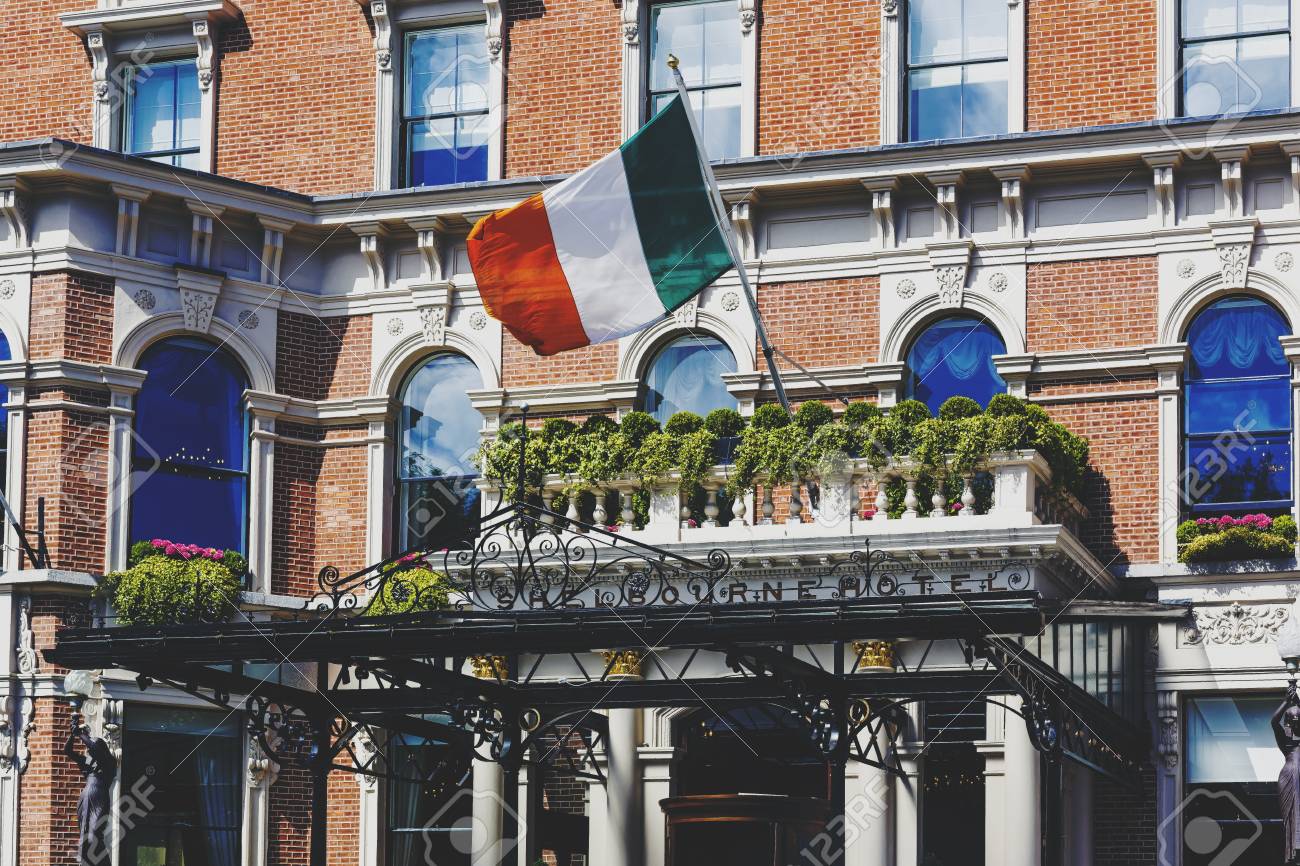 DUBLIN, IRELAND - 10th June, 2017: Detail Of The Irish Flag Waving From The Shelbourne Hotel's Entrance In Dublin Stock Photo, Picture and Royalty Free Image. Image 80069575.