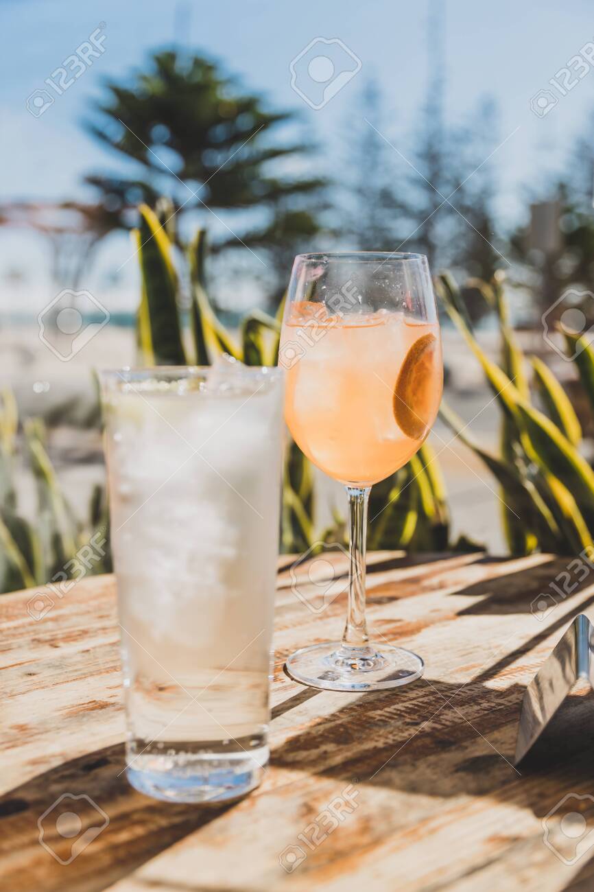 Iced Drinks In Front Of The Beach Water And Cocktail On A Table Stock Photo Picture And Royalty Free Image Image 138183116