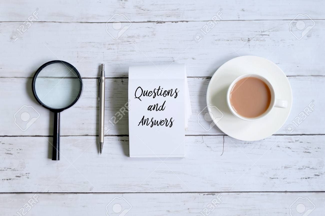 Top view of a cup of coffee,magnifying glass,pen and notepad written with 'QUESTIONS AND ANSWERS' on white wooden background. - 94887895 Top view of a cup of coffee,magnifying glass,pen and notepad written with 'QUESTIONS AND ANSWERS' on white wooden background. - 94887895