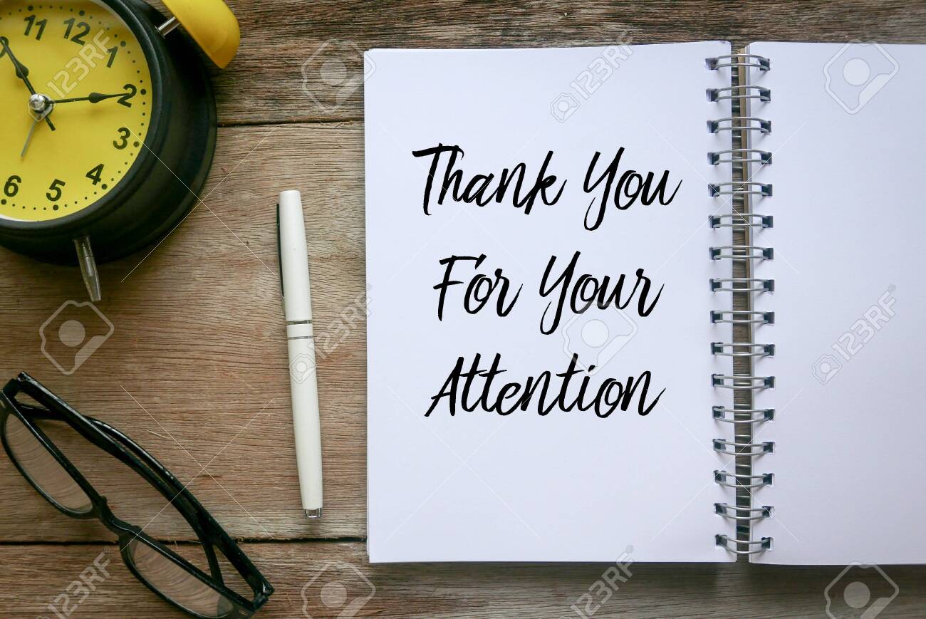 Top view of clock,glasses,pen and notebook written with Thank You For Your Attention on wooden background. - 135135991 Top view of clock,glasses,pen and notebook written with Thank You For Your Attention on wooden background. - 135135991