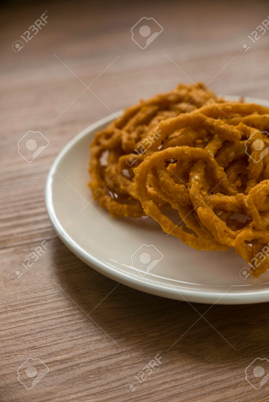 Murukku is a savory, crunchy snack originating from the Indian subcontinent.Its an Indian traditional tea time snack chakli, a deep fried snack, It is known as Chakali, Muruku, Murkoo, Chakri. - 169597071 Murukku is a savory, crunchy snack originating from the Indian subcontinent.Its an Indian traditional tea time snack chakli, a deep fried snack, It is known as Chakali, Muruku, Murkoo, Chakri. - 169597071