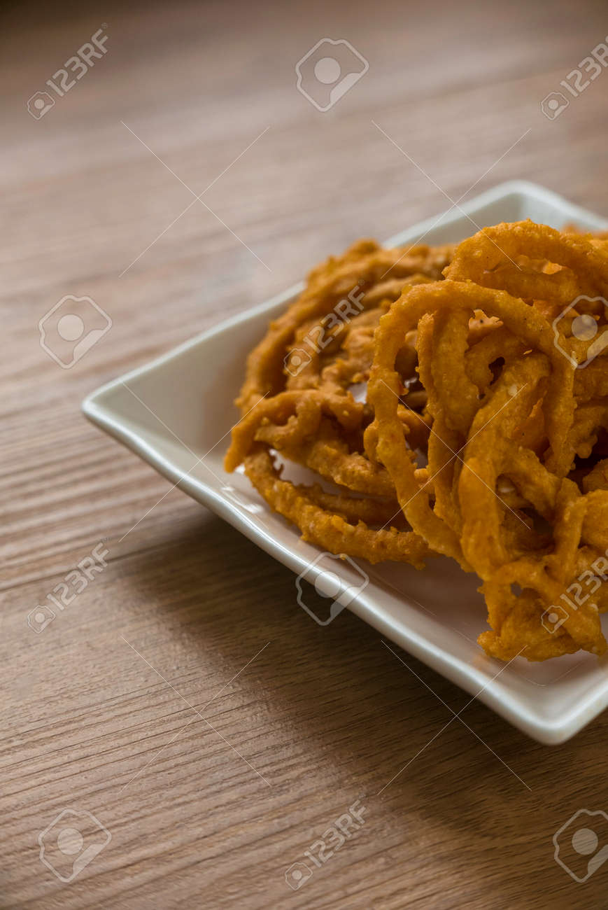 Murukku is a savory, crunchy snack originating from the Indian subcontinent.Its an Indian traditional tea time snack chakli, a deep fried snack, It is known as Chakali, Muruku, Murkoo, Chakri. - 169597216 Murukku is a savory, crunchy snack originating from the Indian subcontinent.Its an Indian traditional tea time snack chakli, a deep fried snack, It is known as Chakali, Muruku, Murkoo, Chakri. - 169597216
