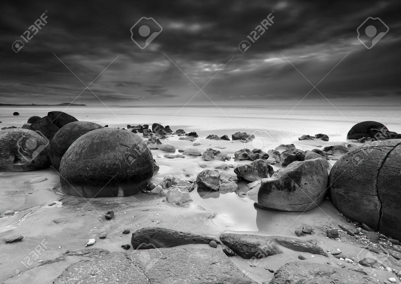 Moeraki boulders on dramatic black and white long exposure new zealand stock photo 23973943