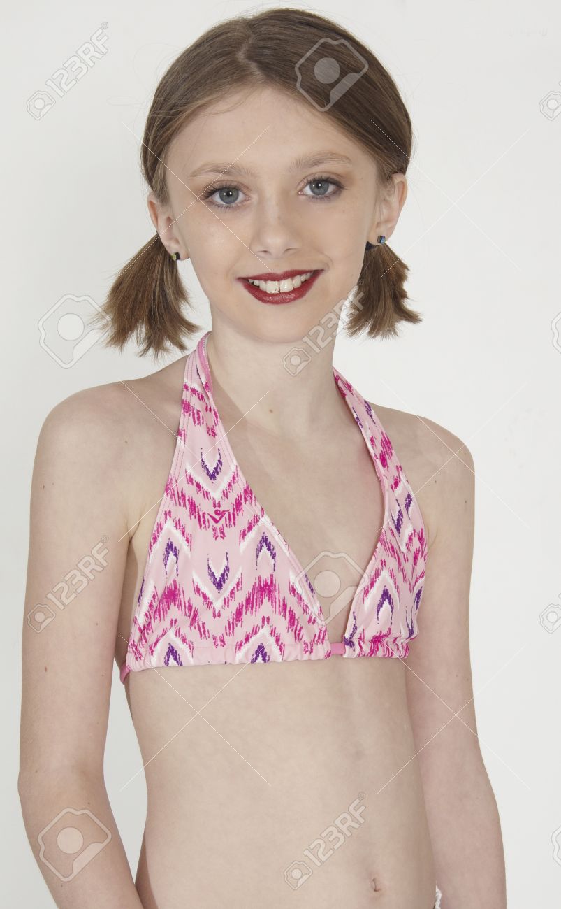 Cute Teen In A Bikini And Ponytails 