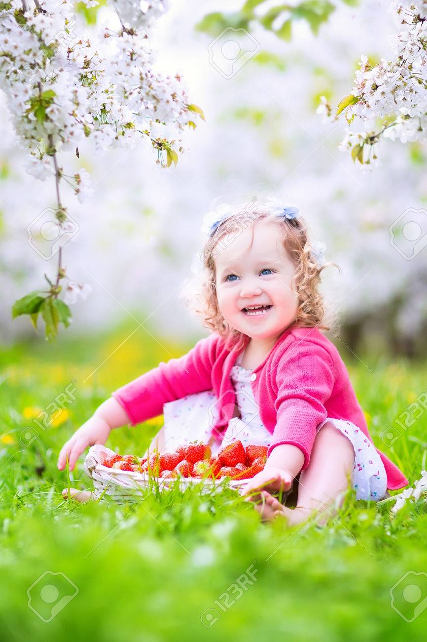 Cute Happy Toddler Girl With Curly Hair And Flower Crown Wearing