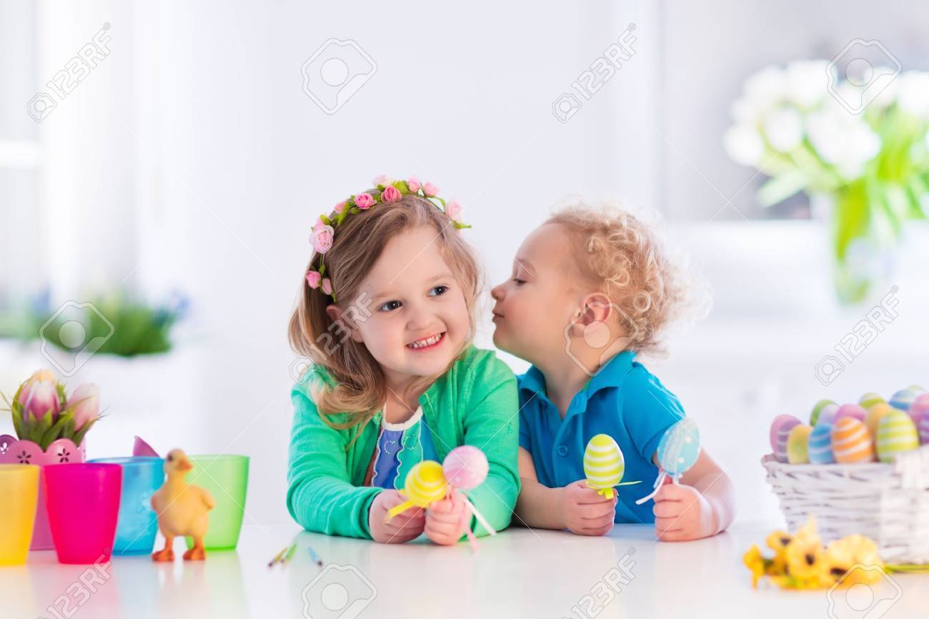 Kids painting colorful eggs children paint and decorate easter egg toddler kid and preschooler