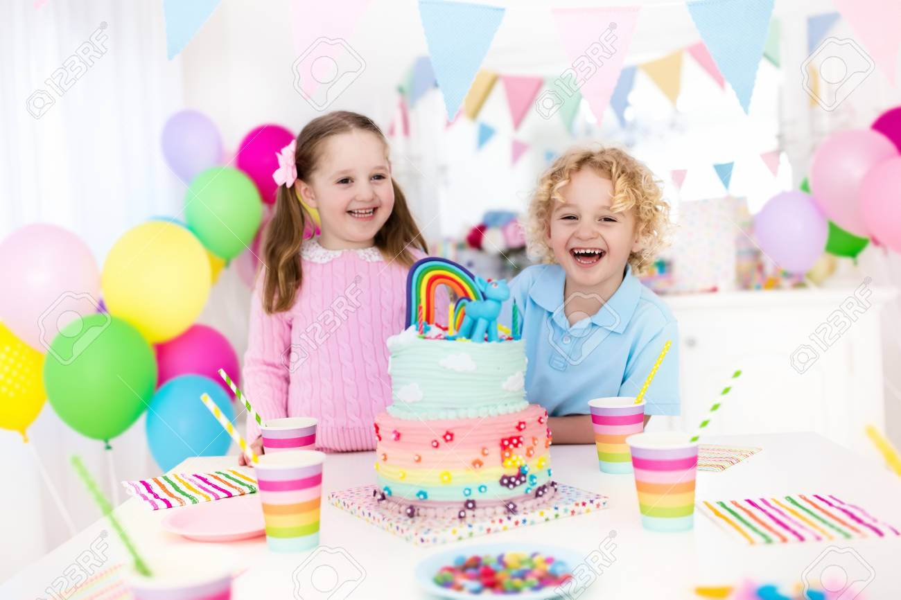 kids birthday party with colorful pastel decoration and rainbow