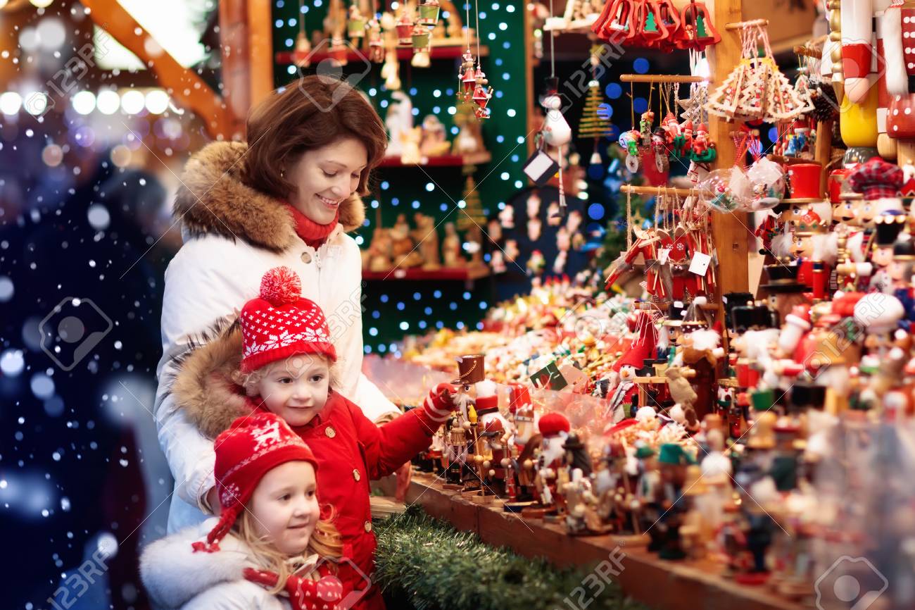 Ordinary Traditional German Christmas Tree Ornaments Part - 8: Mother And Child In Warm Hat Watching Handmade Glass Christmas Tree Ornaments At Traditional German Xmas