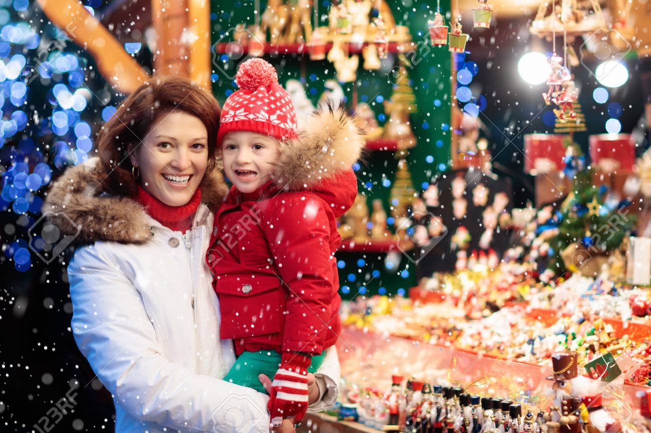 Exceptional Traditional German Christmas Tree Ornaments Part - 10: Mother And Child In Warm Hat Watching Handmade Glass Christmas Tree Ornaments At Traditional German Xmas