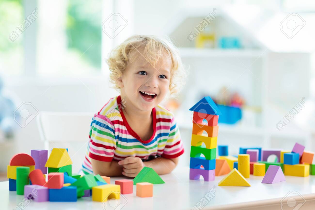 Kid Playing With Colorful Toy Blocks Little Boy Building Tower Stock Photo Picture And Royalty Free Image Image 147787500