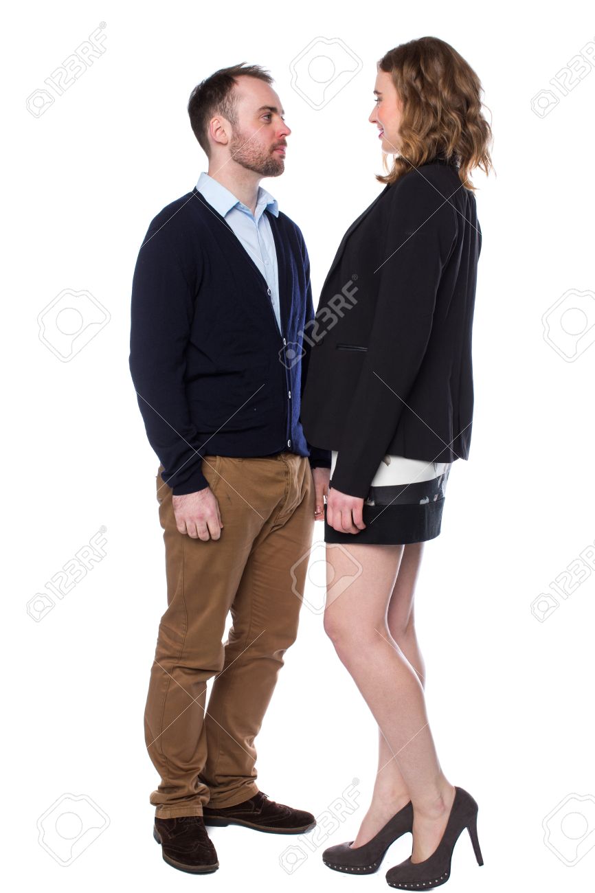 Tall Woman Confronting A Shorter Man Stepping Right Up To Him And Towering  Over Him In A Dominant Manner, Isolated On White Stock Photo, Picture and  Royalty Free Image. Image 31449427.