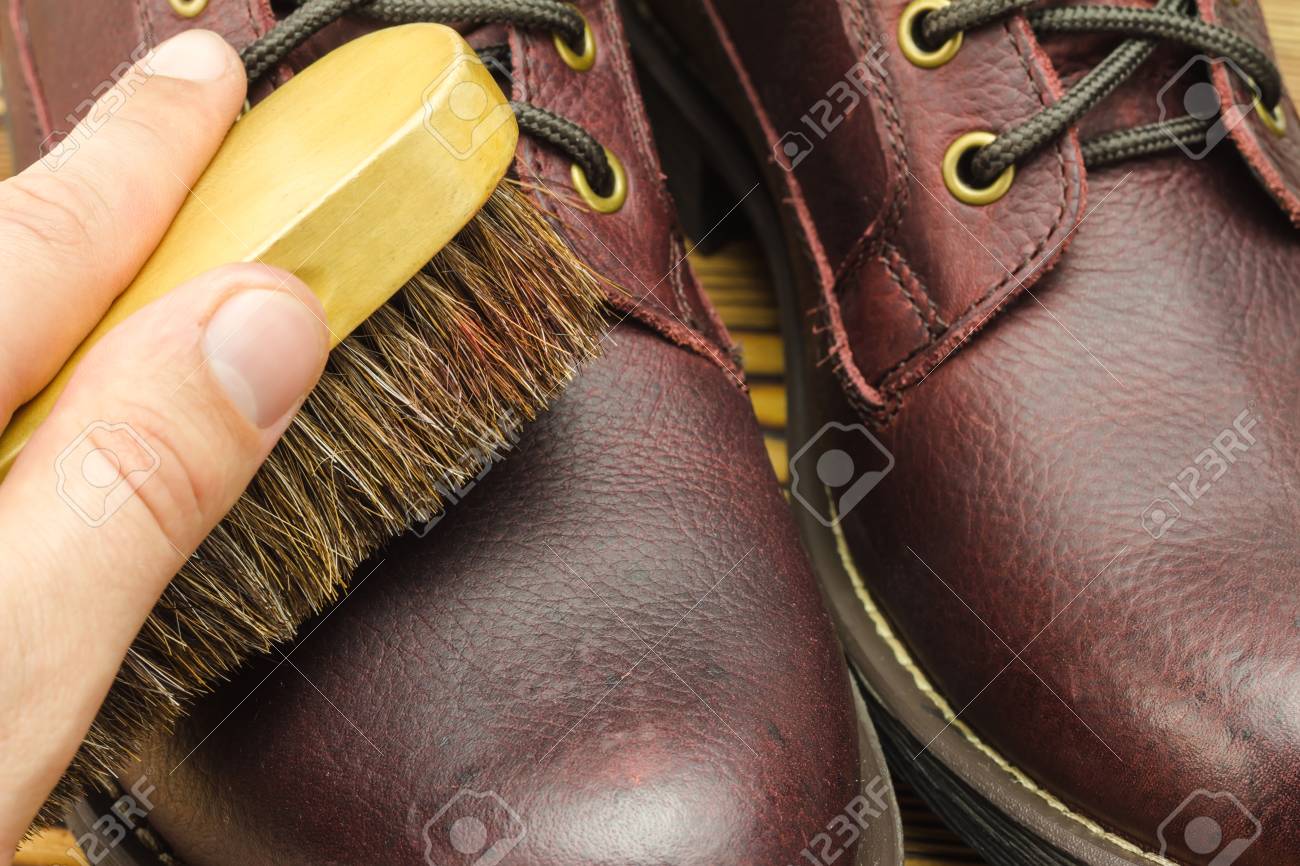 Hand With Brush Care Clean And Polishing Brown Leather Boots Stock Photo Picture And Royalty Free Image Image 73109432