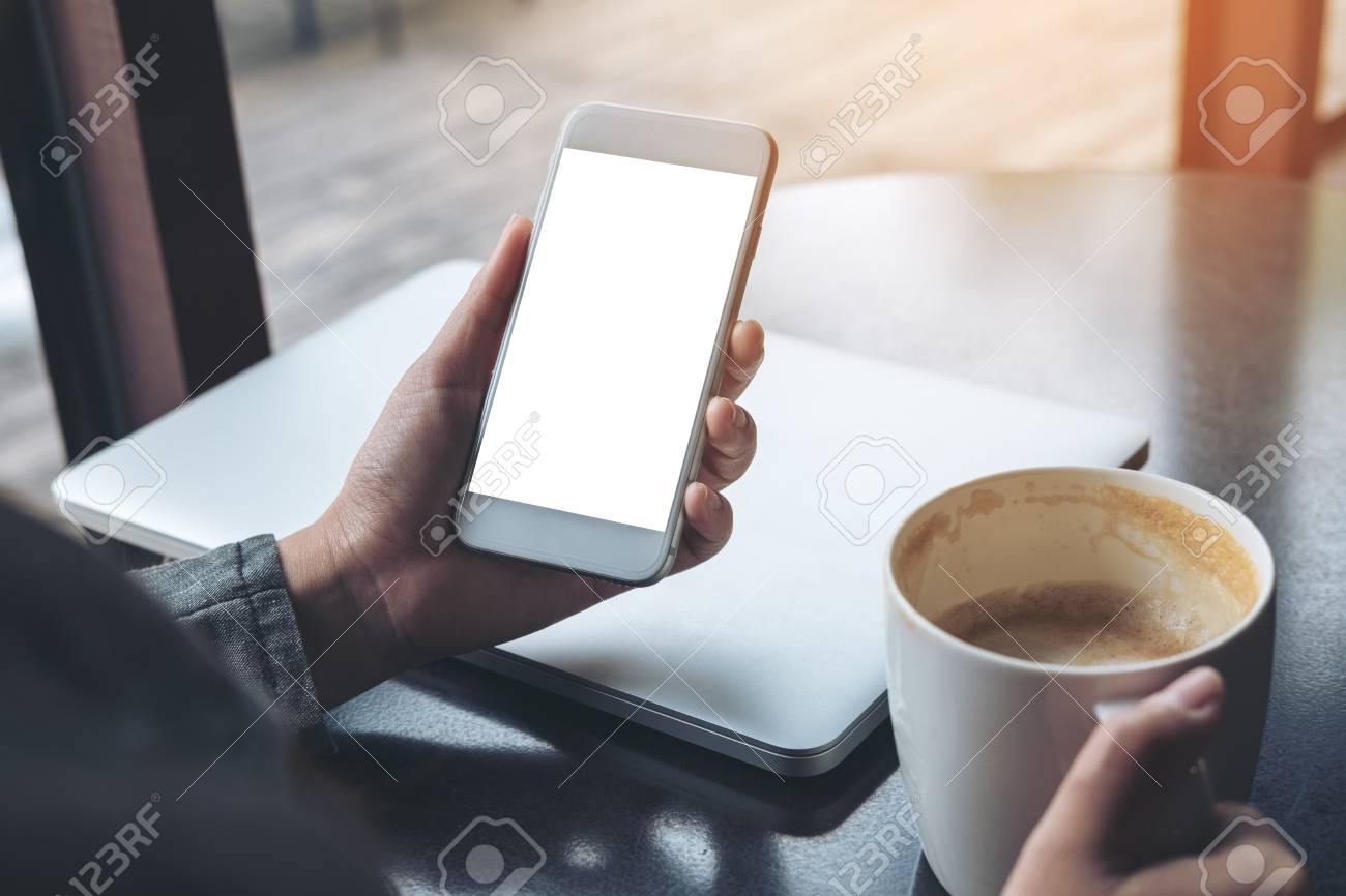 mockup image of mobile phone with blank white screen with latop