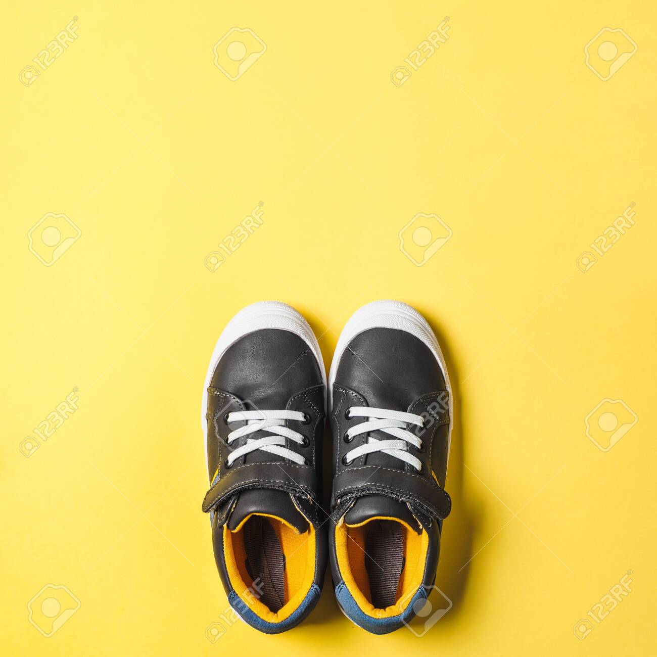 gray and yellow sneakers