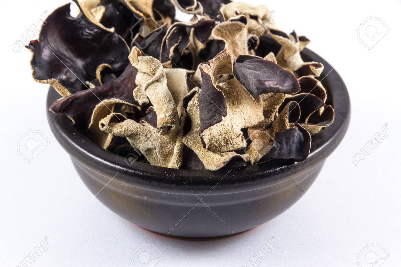 Black Ceramic Bowl With Dried Mushrooms Piled In, Auricularia ...