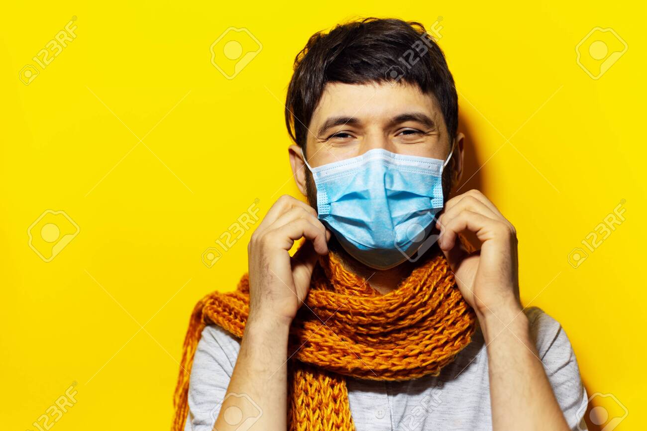 Download Portrait Of Young Smiling Man Wearing Medical Flu Mask And Orange Stock Photo Picture And Royalty Free Image Image 141384124 PSD Mockup Templates