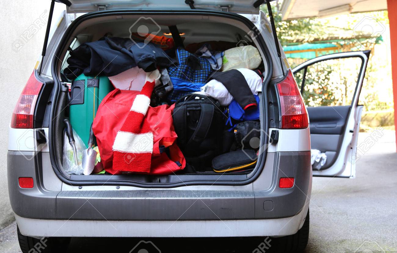 Trunk Of The Car Very Overloaded With Luggage Before The Summer Holiday  Departures Stock Photo, Picture and Royalty Free Image. Image 56013273., image size:1300x830