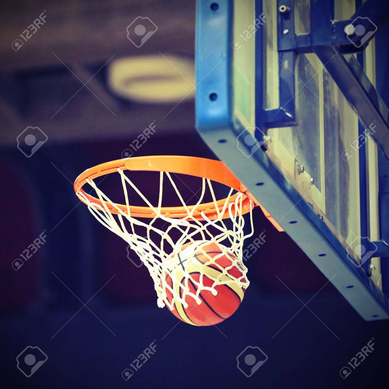 basketball going into the basket after a fantastic shot stock photo